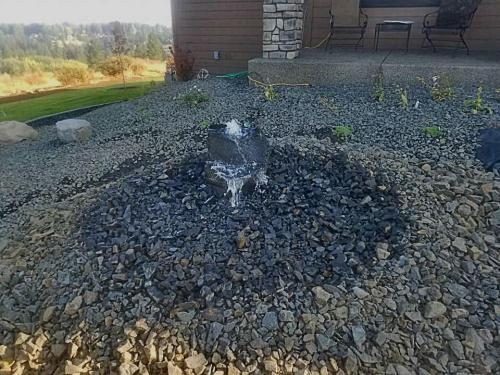 Rock bubbler fountain in a Spokane landscape
