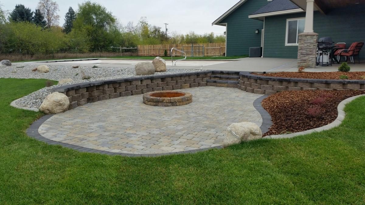 Established sod lawn around a paver patio in Spokane